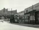 View: ov00248 Sheaf Market, Dixon Lane showing (back left) Hyde Park flats, Bard Street flats and shops (l. to r.) Tom Marsh (Provisions) Ltd., grocers; Granelli's, confectioners and ice cream makers ;R.B. Bingham Ltd., provision merchants 