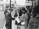 Fargate newspaper seller at the junction with (top left) High Street Fargate newspaper seller at the junction with (top left) High Street