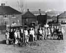 School pupils tree planting in unidentified location