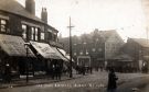 Darnall tram terminus on Staniforth Road at the junction with Main Road showing (left) No. 697 Hibbert's, confectioners and No. 699 Shentall's Ltd, grocer