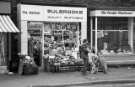 Shops on Abbeydale Road showing No. 555 Bulbrooks, fruiterers and No. 557 The Poodle Parlour, pet stores, mid 1970s