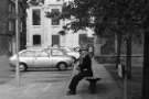 Man sitting on bench, Surrey Place looking towards (centre) Central Library Man sitting on bench, Surrey Place looking towards (centre) Central Library