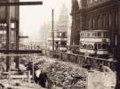 View: rb00026 Trams on Flat Street showing (right) the General Post Office and the construction of the Odeon Cinema, [1954]