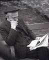 Elderly Sheffield man reading a newspaper