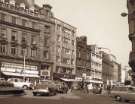 Fargate showing (l. to r.) No. 64 Legal and General Assurance; Nos. 62 - 64 Joan Barrie, ladies fashions; No. 58 Burnley Building Society, Nos. 54 - 56 W. Barratt and Co. Ltd., shoe dealers and No. 52 Paige, gowns Fargate showing (l. to r.) No. 64 Legal and General Assurance; Nos. 62 - 64 Joan Barrie, ladies fashions; No. 58 Burnley Building Society, Nos. 54 - 56 W. Barratt and Co. Ltd., shoe dealers and No. 52 Paige, gowns