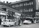 Sheaf Market (Rag and Tag Market) showing shops on Broad Street (l. to r.) W. Ogley, pet store, Harold Coates (Florist) Ltd. and Norfolk Arms, No. 26 Dixon Lane Sheaf Market (Rag and Tag Market) showing shops on Broad Street (l. to r.) W. Ogley, pet store, Harold Coates (Florist) Ltd. and Norfolk Arms, No. 26 Dixon Lane