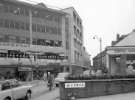 Change Alley from High Street showing (l. to r.) Kendall and Sons Ltd., umbrella makers, F. Corker and Son Ltd., fruiterers and and No. 58 Central Dairy Products Ltd. Change Alley from High Street showing (l. to r.) Kendall and Sons Ltd., umbrella makers, F. Corker and Son Ltd., fruiterers and and No. 58 Central Dairy Products Ltd.