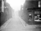 Weigh Lane seen from Duke Street, No. 139 Fred Thorpe, pork butcher, right. Back to back housing, left