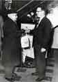 Opening of new Stocksbridge Co-operative Society, Manchester Road, Deepcar showing shop manager presenting a bag of groceries to a customer Opening of new Stocksbridge Co-operative Society, Manchester Road, Deepcar showing shop manager presenting a bag of groceries to a customer