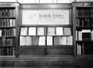 View: s46456 Display of reports on Nuclear Science, Commerce and Technology Library, Central Library, Surrey Street showing (right) Jean Clark, library assistant c. late 1950's