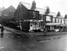 Bellhouse Road showing (l. to r.) No. 44 Abbey National Building Society; No. 42 D. O'Brian, fish and chip shop; No. 40 Warwick's, fishing tackle shop and Henry Wigfall and Son Ltd.,