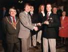 View: s46811 Handing over of the Torch for the World Student Games in Sheffield showing (1st left) the Lord Mayor, Councillor James Moore, (2nd left), Leader of the Council, Councillor Clive Betts and (1st right) Lady Mayoress, Mrs Sheila Moore