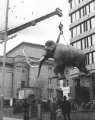 Mammoth sculpture being positioned in Barkers Pool Gardens showing (back) City Hall and (right) Fountain Precinct offices