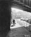 Man with shopping walking under the Heeley railway bridge, London Road looking towards Nos. 577 - 609 H. Ponsford Ltd., furniture dealers Man with shopping walking under the Heeley railway bridge, London Road looking towards Nos. 577 - 609 H. Ponsford Ltd., furniture dealers