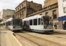 Supertram No. 10 and No. 16 at Fitzalan Square / Ponds Forge Supertram stop, Commercial Street showing (centre left) Canada House (the old Gas Company offices) 
