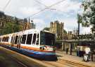 Supertram No. 123 at the Cathedral tram stop, Church Street showing (right) Sheffield Cathedral and (top left) Gladstone Buildings, St. James Row