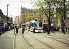 Supertram No. 124 on Church Street at Cathedral Supertram stop showing (back centre) Gladstone Building, offices