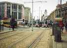 View from Commercial Street of Supertrams at Castle Square Supertram stop showing (left) T. J. Hughes, department store, High Street View from Commercial Street of Supertrams at Castle Square Supertram stop showing (left) T. J. Hughes, department store, High Street