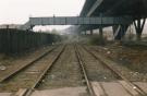 View: sypte00495 South Yorkshire Transport Executive (SYPTE). Rail tracks and footbridge alongside the Tinsley Viaduct
