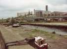 South Yorkshire Passenger Transport Executive (SYPTE). Canal basin prior to restoration showing (centre)) Supertram Bridge alongside Parkway and (back) Hyde Park flats