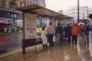 South Yorkshire Passenger Transport Executive (SYPTE). Bus shelter on High Street showing (left)  Nos. 14 - 18 HMV Music Store