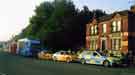Event and police vehicles for the Olympics 2012 torch procession parked on Worksop Road showing (right) No.74 Faras public house