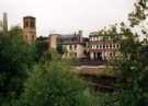 View over the river of Nursery Street showing (right) No. 58 Riverside House and (left) Holy Trinity C. of E. 