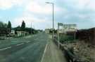 Mansfield Road showing (left) the bus terminus and (right) advertising boards for a new housing estate on Wadsworth Road