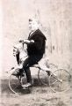 Unidentified child riding a tricycle Unidentified child riding a tricycle