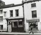 The Saddle Inn, No. 94 West Street showing (right) R. G. and A. Mitchell, locksmiths