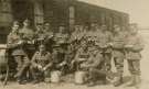 Unidentified group of First World War soldiers peeling potatoes - John Herbert Brown, far left