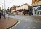 Glossop Road at the junction of (foreground) Fitzwilliam Street showing (centre) No. 256 John Sinclair Ltd., glass and china dealers and cafe,and (right) Nos. 252 - 254 Boots, chemists