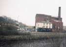 Looking across the River Don to Manchester Hotel (latterly the Harlequin P.H.), No. 108 Nursery Street) and Aizlewoods Mill (formerly the Crown Corn Mill of John Aizelwood Ltd.), Nursery Street from Riverside Walk over the River Don to Nursery Street Looking across the River Don to Manchester Hotel (latterly the Harlequin P.H.), No. 108 Nursery Street) and Aizlewoods Mill (formerly the Crown Corn Mill of John Aizelwood Ltd.), Nursery Street from Riverside Walk over the River Don to Nursery Street