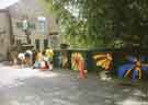 Children painting mural on Hill Bridge, also known as Walkley Lane Bridge, Walkley Lane, showing (top left) No. 383 Freemasons Arms