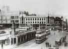 Trams in Fitzalan Square looking towards High Street and Haymarket showing (top left) C and A Modes Ltd., Nos. 59 - 65 High Street