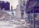 Demolition of Huntsman's Gardens School at the junction of Britnall Street and Titterton Street, showing the school hall and dining hall entrance