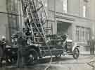 Fire engine with extended ladders outside William Marples and Sons, edge tool manufacturers, Hibernia Works, Westfield Terrace, Division Street