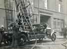 View: u11173 Fire engine with extended ladders outside William Marples and Sons, Hibernia Works, Edge Tool Manufacturers, Westfield Terrace, Division Street