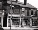 Barber Road showing No. 18 M. and N. Poke, newsagents and (right) No. 16 G. Worrall, chemists
