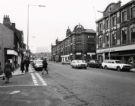 View: u11596 West Street at the junction with (left) Eldon Street showing (right) J. Preston Ltd., chemists and laboratory furnishers and (centre) No. 210 T. A. Brooks and Co. Ltd., shoe dealers