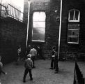 Children in the playground, Walkley Nursery, Infant and Junior School, Greaves Street (latterly Burnaby Crescent) 