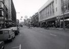 View: u11720 Shops on The Moor at Christmas showing (r.to l.) No. 29  Montague Burton Ltd., tailors; Nos. 15 - 19 F. W. Woolworth and Co. Ltd., department store and (left) Debenhams, department store