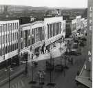 Shops on The Moor showing (centre) Nos. 15 - 19 F.W. Woolworth and Co. Ltd., department store