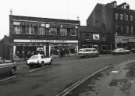 Junction of (foreground) Devonshire Street and (centre) Fitzwilliam Street showing Kennings Ltd., parts centre, Nos. 12 - 14 Raven Tavern and Nos. 8 -10 Neville Watts of Sheffield, architectural and builders ironmongery 
