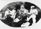 'Granny Whitworth' [Anna Maria Whitworth?] knitting for soldiers in 1915 with her indoor staff and daughter in law., Burrowlee House, Burrowlee Road