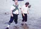 Sheffield City Morris members in the River Wharfe at Burnsall, North Yorkshire