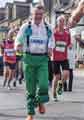 Sheffield City Morris. Team member running in the Yorkshire Marathon during the Whitby Folk Week