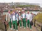 Sheffield City Morris. Team members climbing the 199 steps to perform at Whitby Abbey during Whitby Folk Week, North Yorkshire