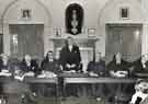 Unidentified group of men in a meeting