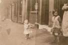 View: v05086 Gertrude Oxley (nee Morris) (born 1906), wife of George Edwin Oxley (just out of shot), with her daughter, Brenda Oxley (born 1934) (later Brenda Jackson), Hoyle Street